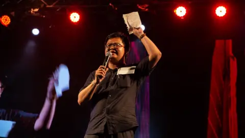 Lauren DeCicca Anon Nampa, a Thai human rights lawyer, gives a speech at an anti-government protest at Thammasat University on August 3, 2020 in Bangkok, Thailand.