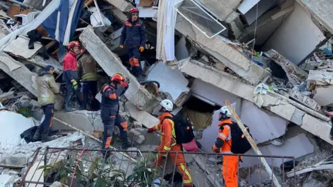 Lincolnshire Fire and Rescue Service Rescue team at work on rubble