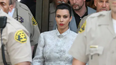 Getty Images Kim on her way to a divorce hearing as she split from Kris Humphries