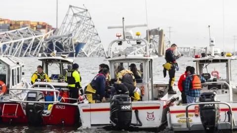 EPA Rescuers prepare to take boats out to the site of the boat crash