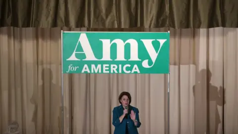 Getty Images Democratic presidential candidate Sen. Amy Klobuchar (D-MN) speaks during a campaign event at Cedar Falls Womans Club