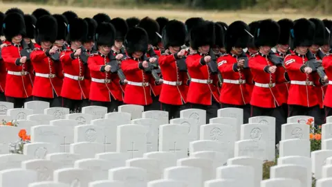 EPA The Irish Guards arrive at the Tyne Cot Commonwealth War Graves Cemetery for the commemorations