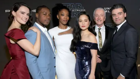 Getty Images Daisy Ridley, John Boyega, Naomi Ackie, Kelly Marie Tran, Anthony Daniels and Oscar Isaac