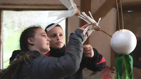 Rachel Palmer Image of two children creating artwork