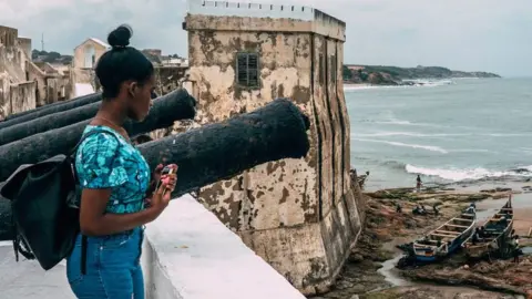 Getty Images Woman at Cape Coast Castle in Ghana