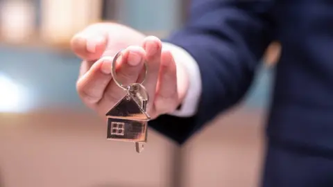 Getty Images Letting agent with keys