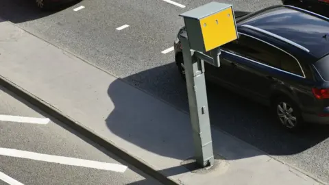 Getty Images Car driving past speed camera