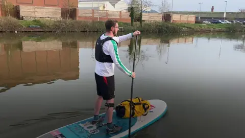 Alex Kell paddleboarding