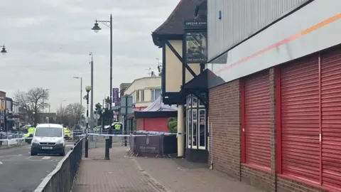 Mousumi Bakshi/BBC Police cordon by The Haystack pub