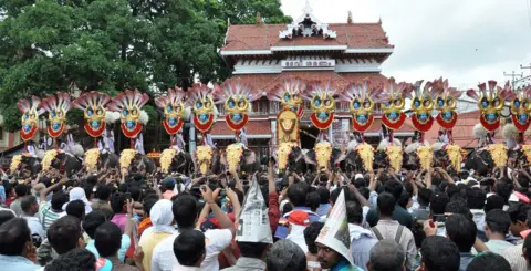 AFP Thousands of Pooram fans watch the processions led by caparisoned elephants in Thrissur, in the southern Kerala state on May 1, 2012