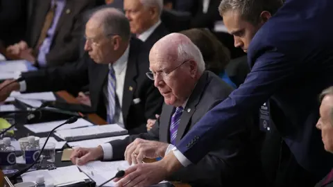 Getty Images Sen Patrick Leahy receives notes from an aide while questioning Brett Kavanaugh on September 5, 2018