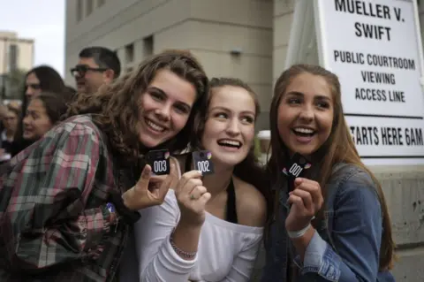 Getty Images Fans waited for hours to view the sexual assault trial from inside the courtroom