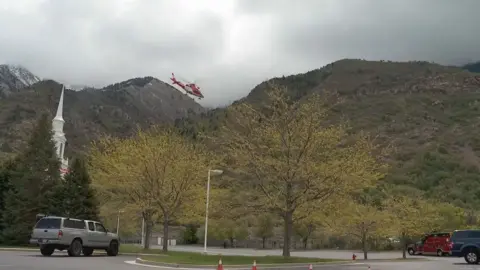 CBS/KUTV A rescue helicopter heads to Lone Peak in Utah