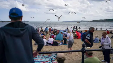 Getty Images Seagulls divebombing people on Scarborough beach