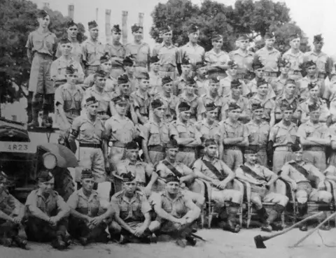 Dennis Morley The Second Battalion The Royal Scots, Hong Kong. Dennis Morley is third row down, third from the left.