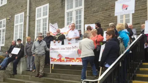 Amman Valley hospital campaigners arrive for the health board meeting in Carmarthen