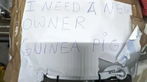 RSPCA Note left on cage with guinea pig