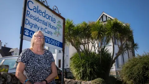 Mandy Jones Photography Ann Bedford outside the Caledonia care home