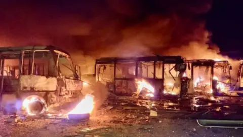 Dnipropetrovsk regional administration Burnt buses in Dnipro, Dnipropetrovsk region, central-eastern Ukraine. Photo: 30 September 2022