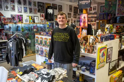 Thomas Banks Liam Guille stands in Marvellous Toys on Fore Bondgate