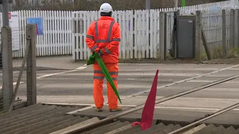 Guard at level crossing
