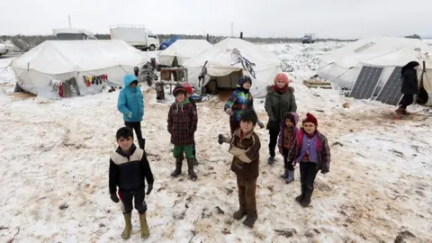 Reuters Displaced Syrian children at a makeshift camp in Azaz, Aleppo province (13 February 2020)