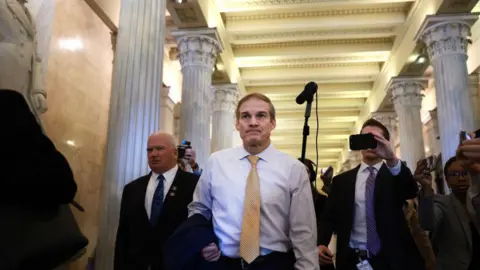Getty Images Jim Jordan walks to the House chambers ahead of vote for Speaker