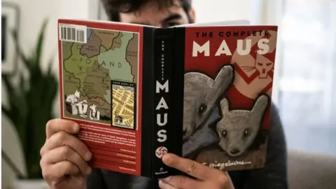 Getty Images A person reading Maus