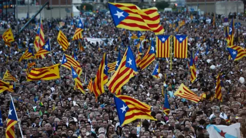 AFP This file photo taken on September 25, 2015 shows people waving Catalan and Catalan independence flags (Estelada) during the Catalan independence coalition "Junts pel Si" (Together for the Yes) party"s final campaign meeting for the regional election, in Barcelona.