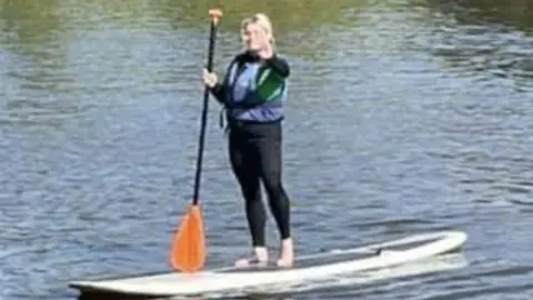 Family photo Emma Powell on a paddleboard