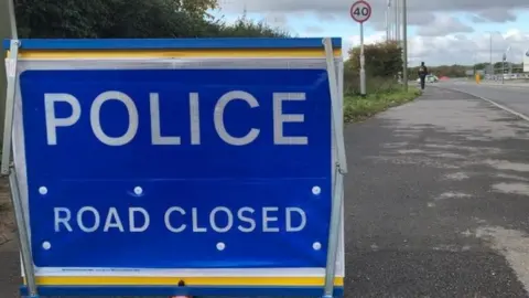 BBC Police road closed sign