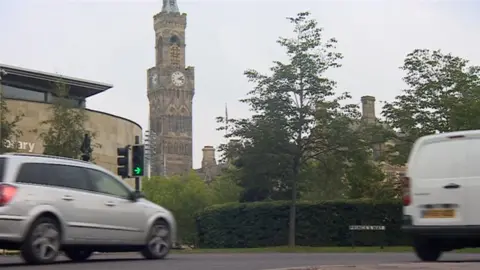 Cars driving down a main road in Bradford