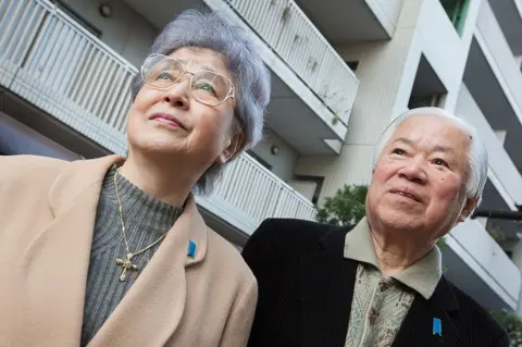 Getty Images Shigeru Yokota and wife Sakie (L), parents of daughter Megumi who was abducted in 1977 by North Korea, outside their home in Tokyo on February 09, 2011