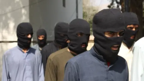 Getty Images Suspected Islamic State militants captured in Nangarhar province, Afghanistan. File photo