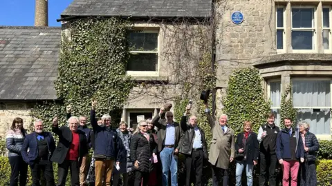 Cllr Barrie Jennings, James Arkell and descendants of John Arkell gathered to view the commemorative plaque