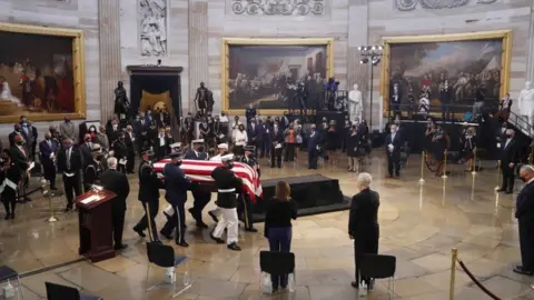 EPA The casket of US Representative from Georgia John Lewis arrives during a ceremony preceding the lying in state in the Rotunda of the US Capitol in Washington, DC