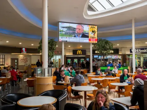 Peter Dench Labour leader, Jeremy Corbyn, speak to Sky News on a television screen at an Extra Motorway Services. Haddon, Cambridgeshire.