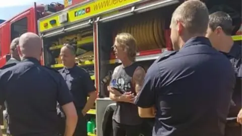Stapleford railway Duff McKagan chats to a fire crew
