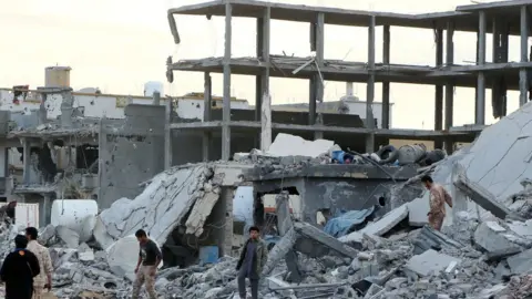 Getty Images Destruction in the Giza al-Bahriya area of Sirte, days after the entire city was captured in December 2016