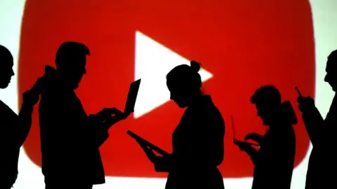 Reuters People in front of a YouTube logo