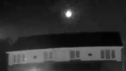 The fireball was filmed when a neighbour's cat accidentally triggered CCTV on a doorbell.