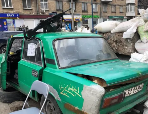 BBC/Jeremy Bowen A car positioned at a roadblock in Kyiv