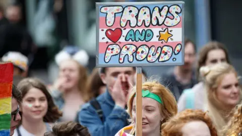 Getty Images "Trans and proud" sign at Glasgow Pride