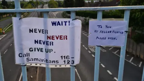 Rocco Hawkins Sign on a bridge