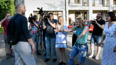 Getty Images Arkady Babchenko is reunited with work colleagues