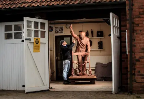 Danny Lawson / PA Media Andrian Melka with his statue