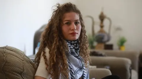 Anadolu Agency File photo showing Ahed Tamimi at her home in Ramallah, in the occupied West Bank, on 16 May 2021