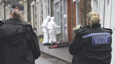 BBC Police officers at the scene in Treforest after the body was found