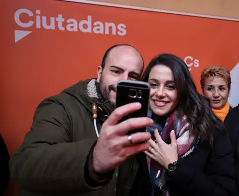 Reuters Catalan Cs leader Ines Arrimadas poses for a selfie with a supporter in Figueres, 15 December