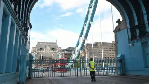 PA Media Traffic queuing behind the locked gates of Tower Bridge